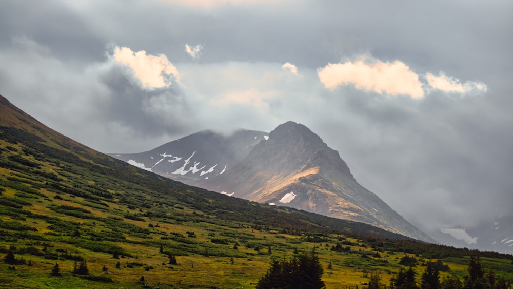 a large mountain with snow on top of it