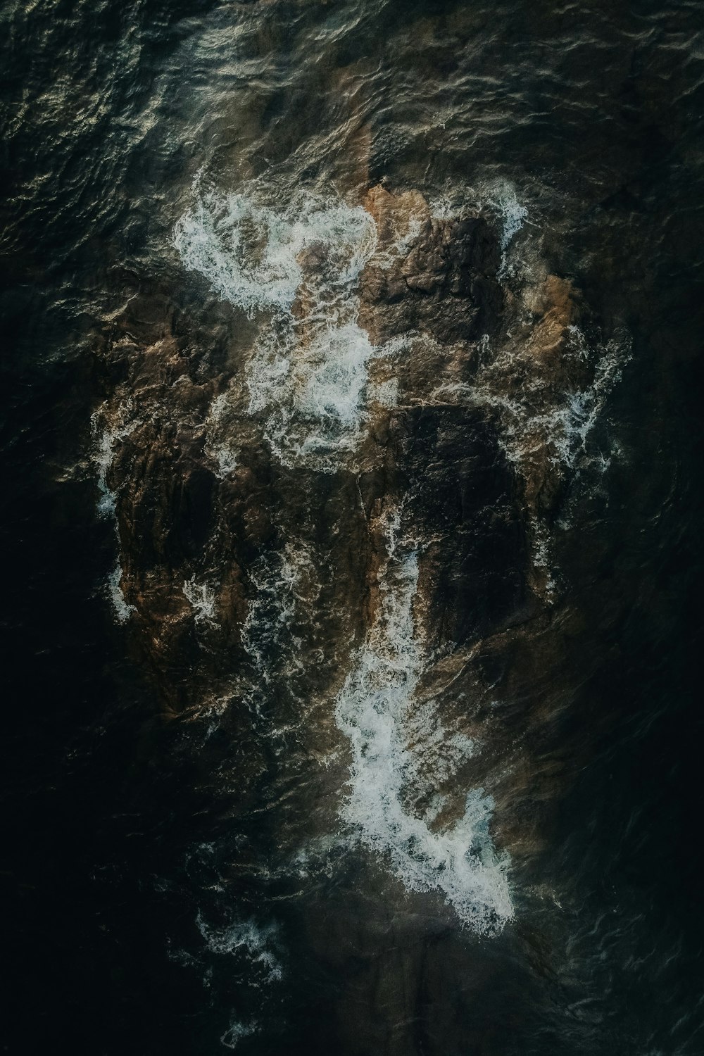 a large body of water surrounded by rocks