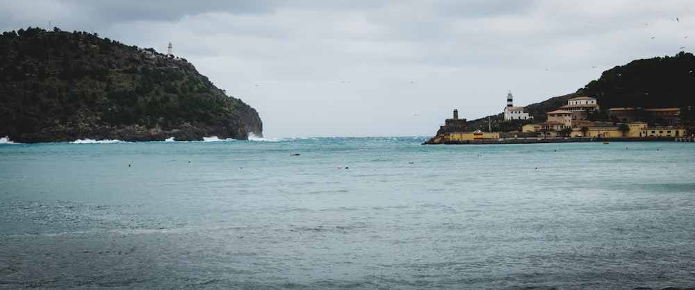 a body of water with a small island in the background