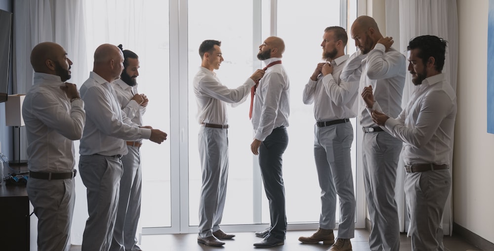 a group of men standing next to each other