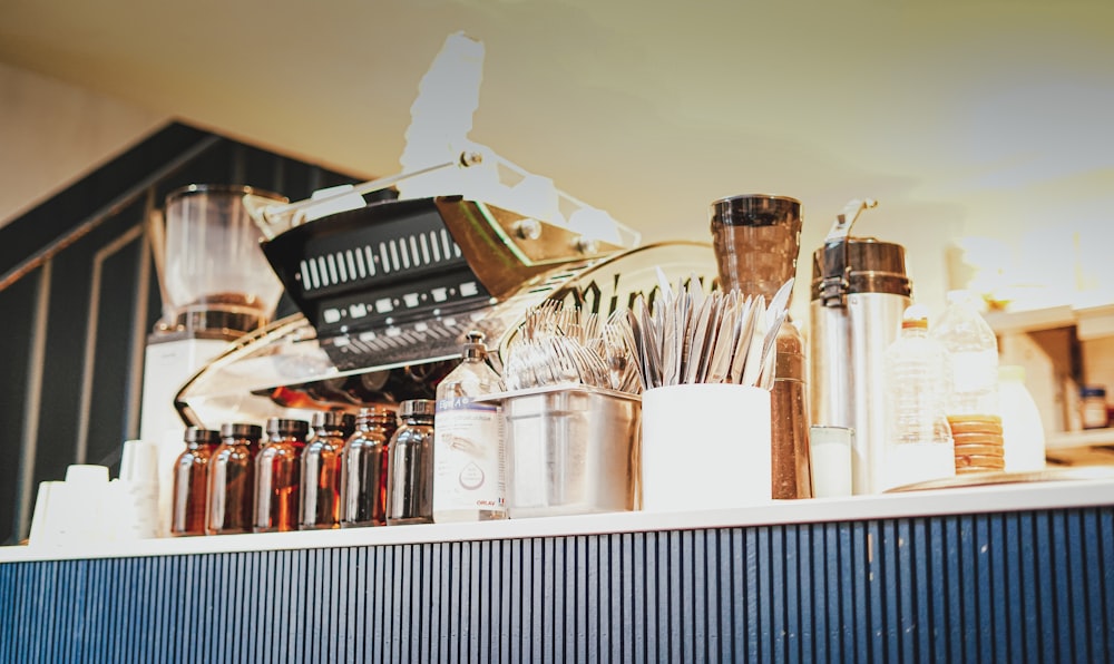 a kitchen counter with a variety of cooking utensils