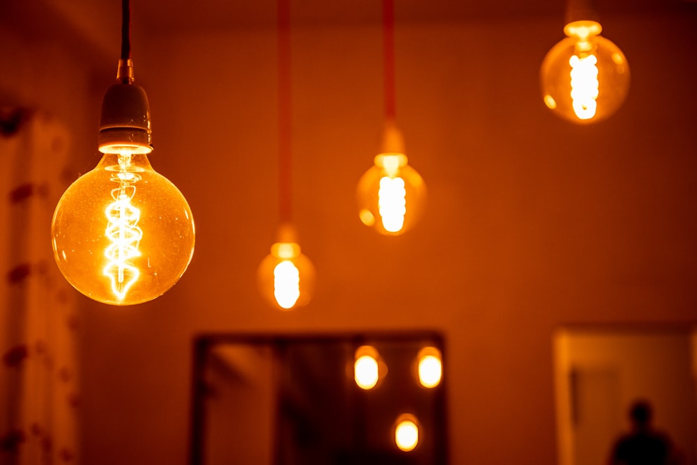 a group of light bulbs hanging from a ceiling