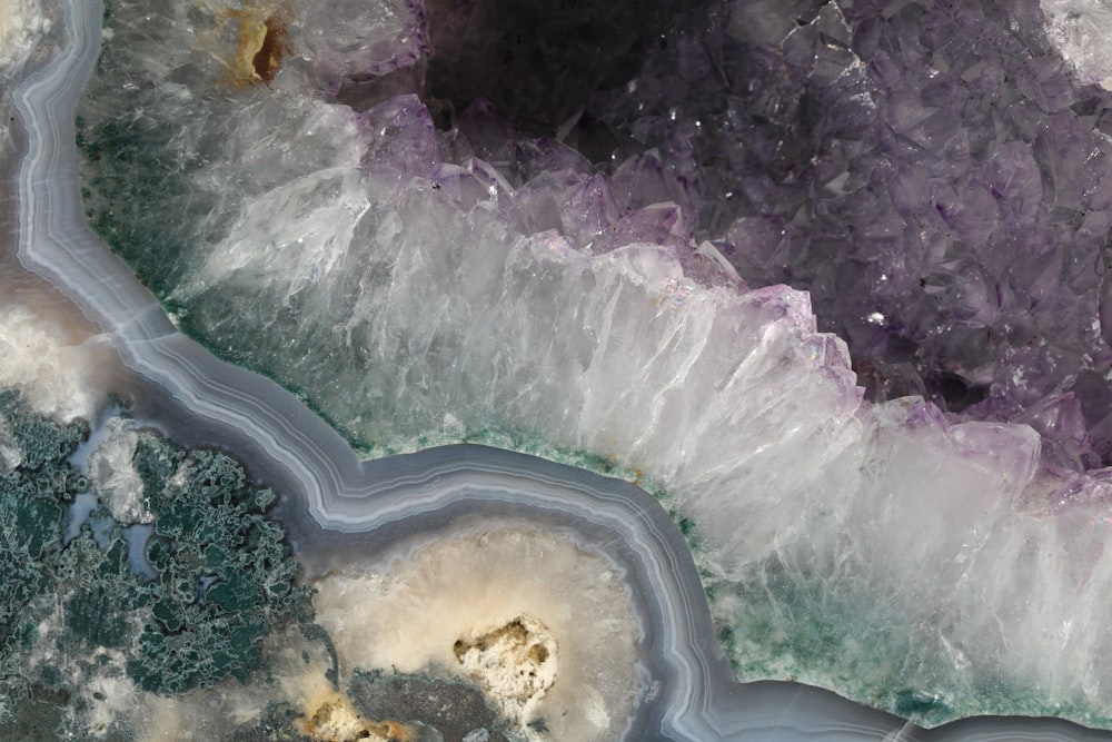 an aerial view of a river running through a forest