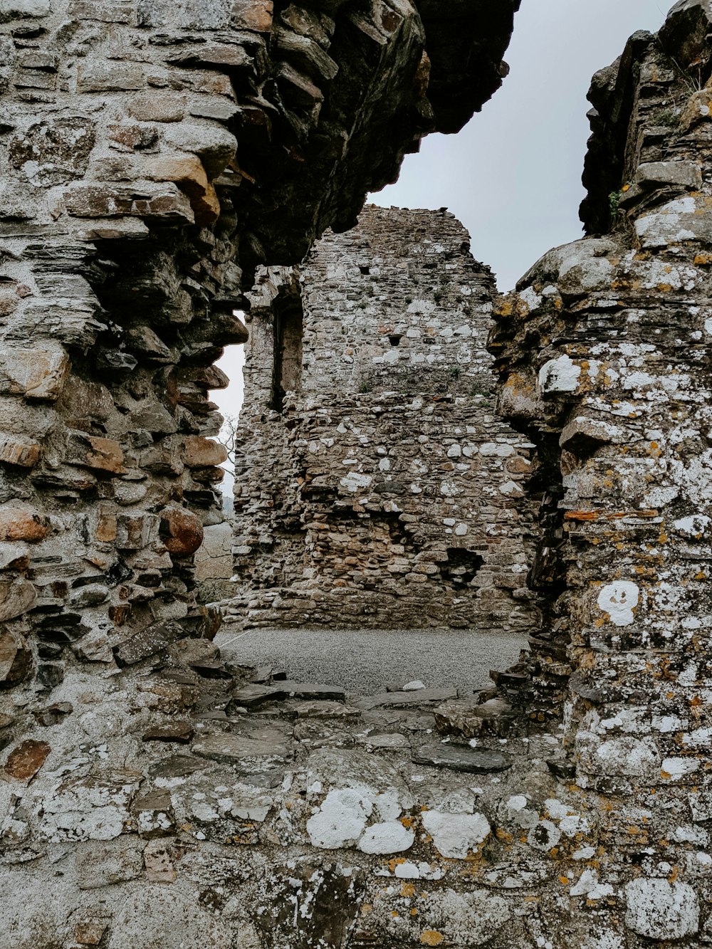 a stone building with a window in the middle of it