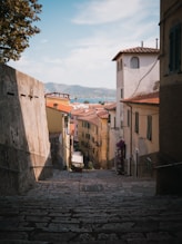 a cobblestone street in a small town
