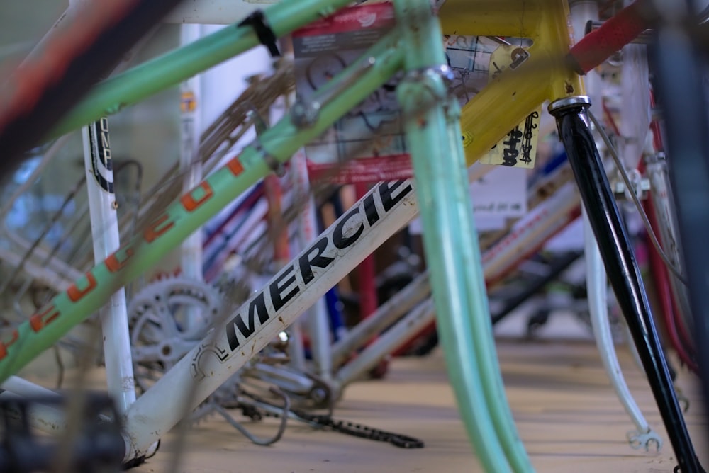a close up of many different colored bikes