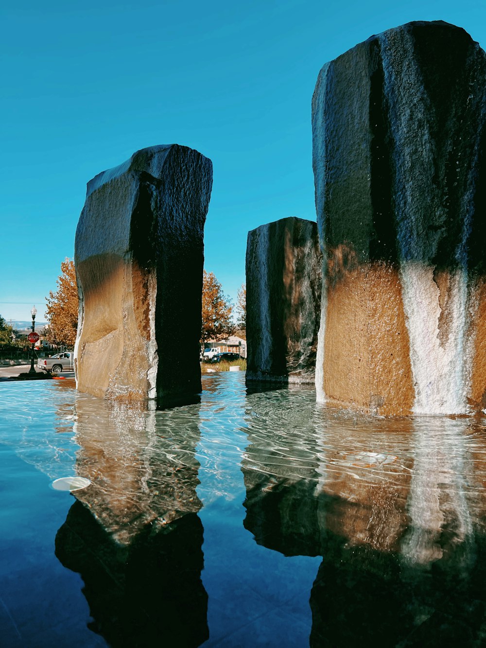 a body of water surrounded by large rocks