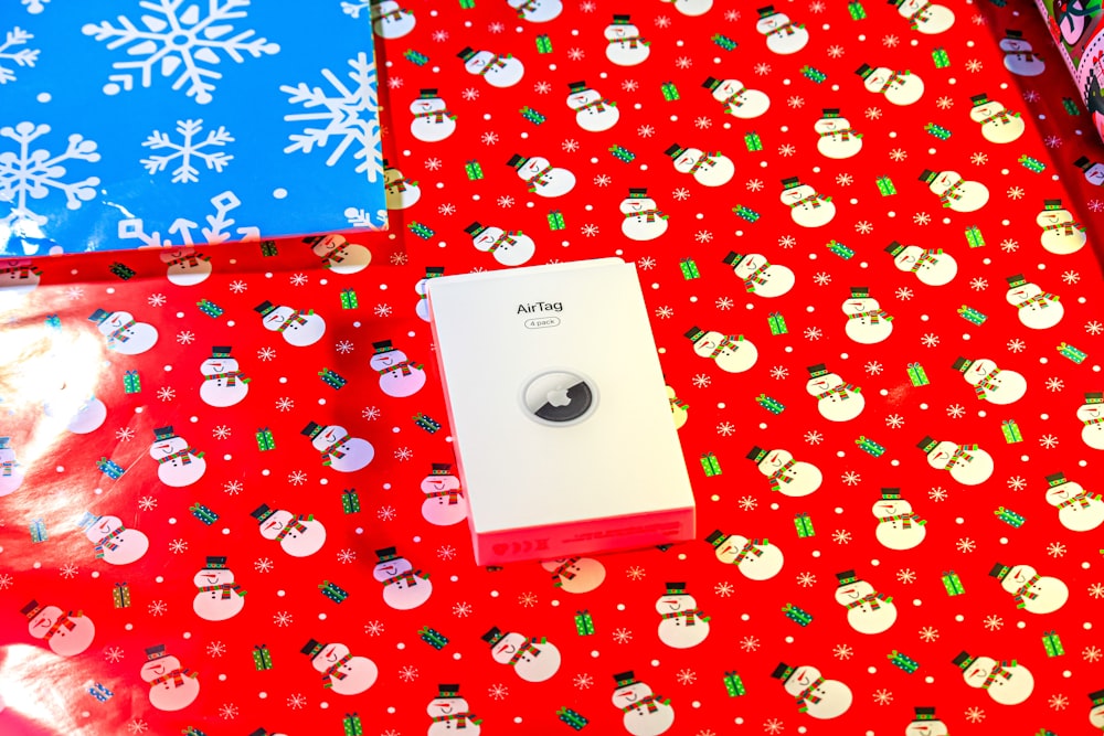 a red table topped with lots of wrapping paper