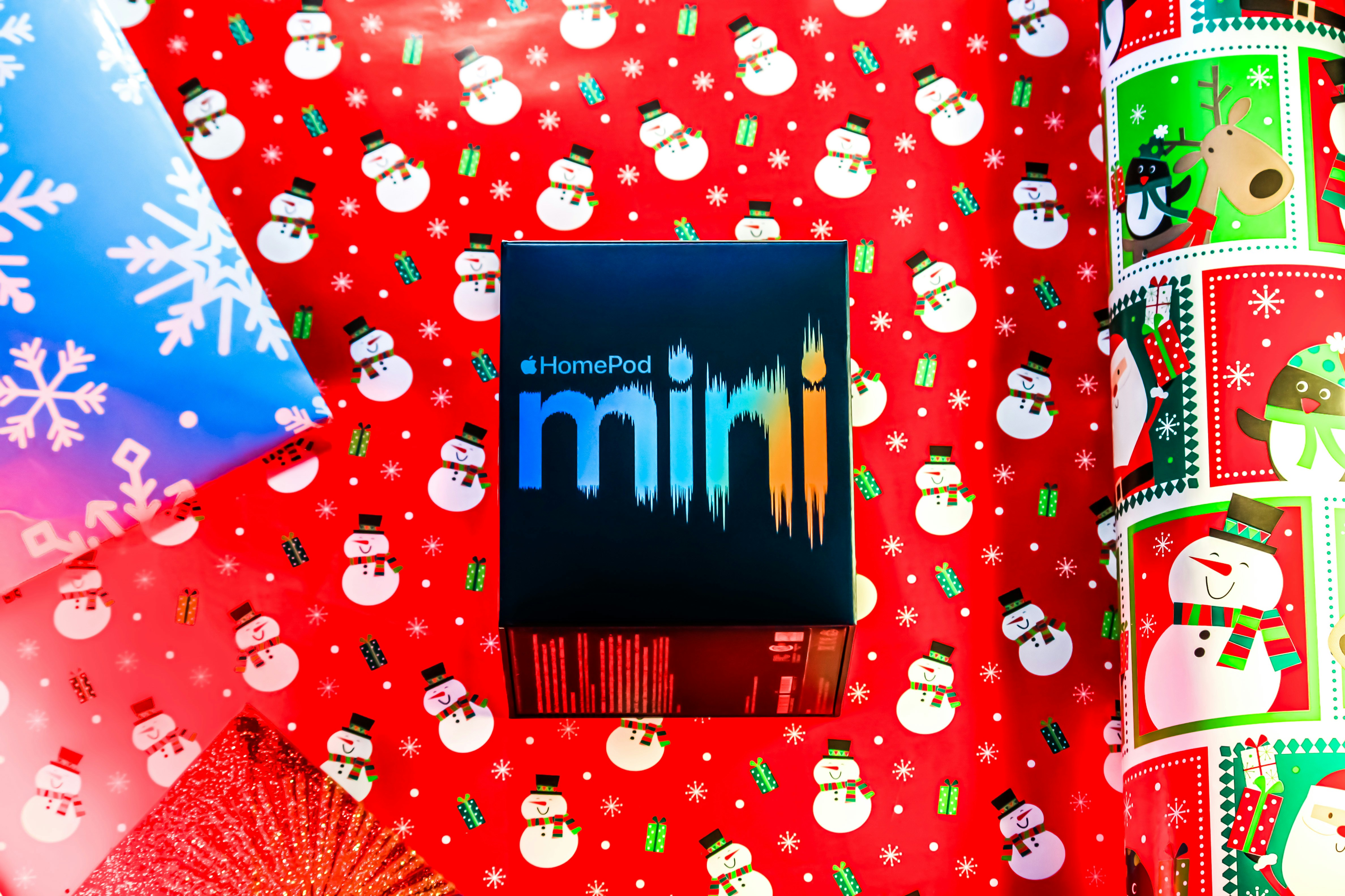 a red background with snowmen, snowmen, and snowflakes