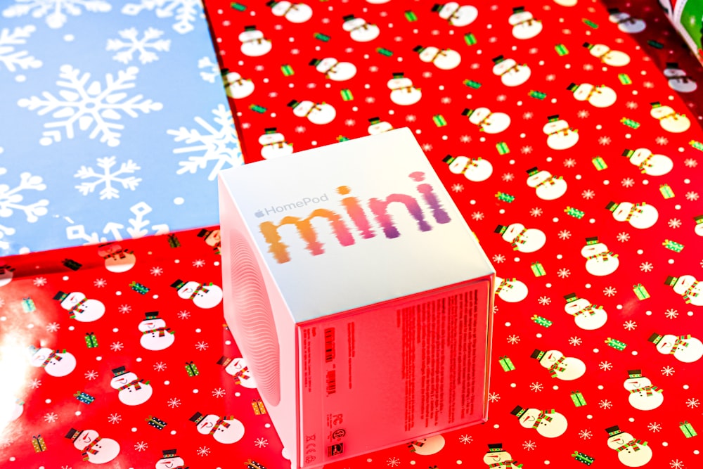 a carton of candy sitting on top of a table covered in wrapping paper