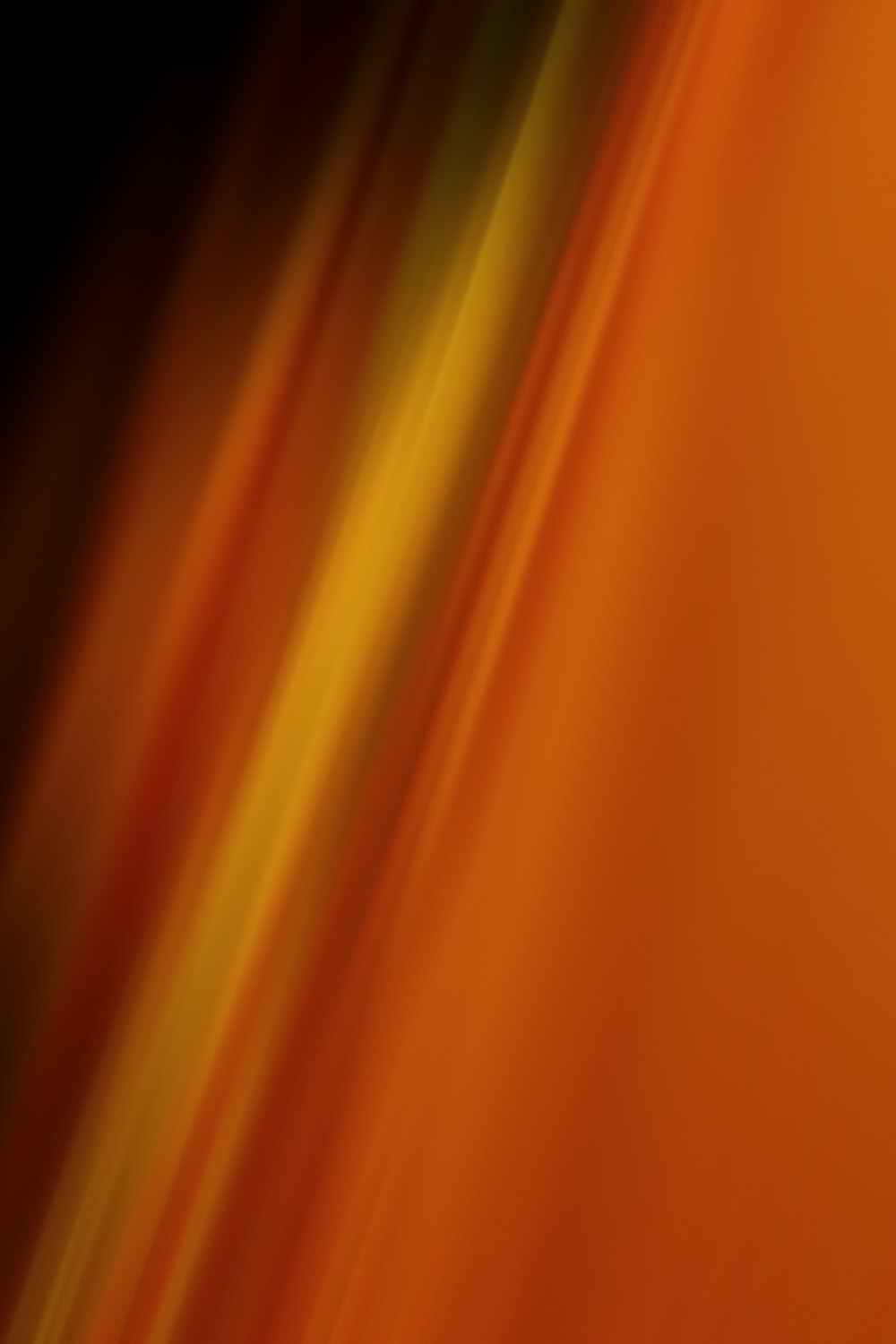 a blurry orange background with a black background