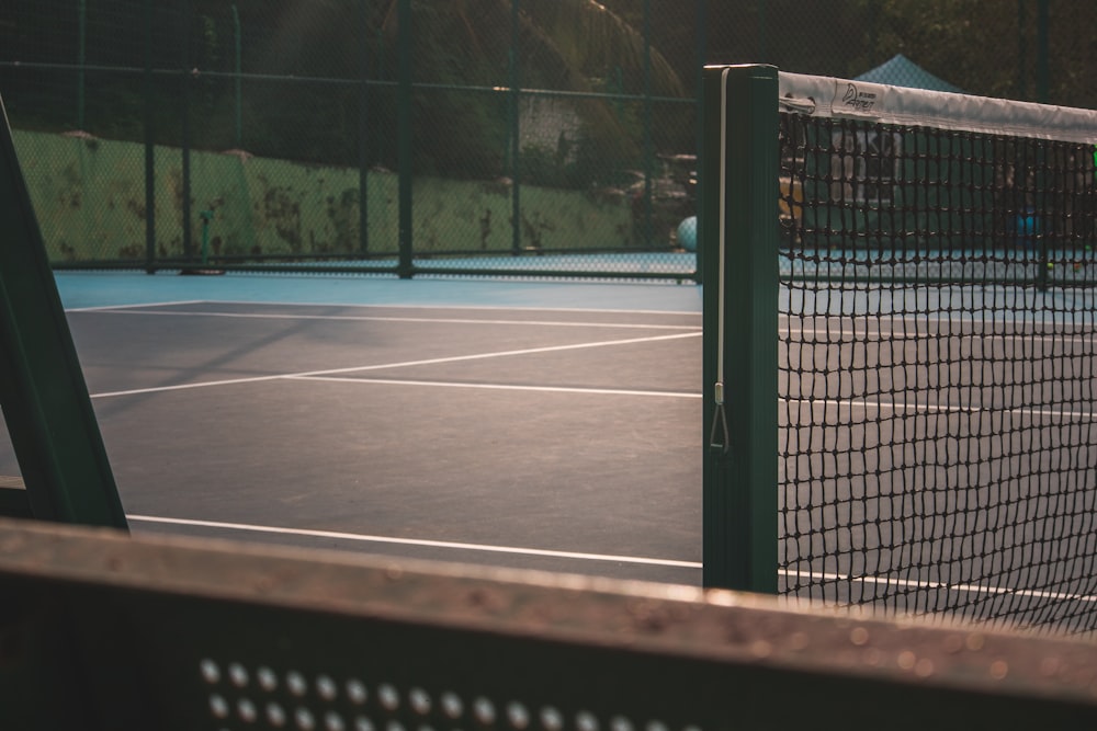 a tennis court with two tennis players on it