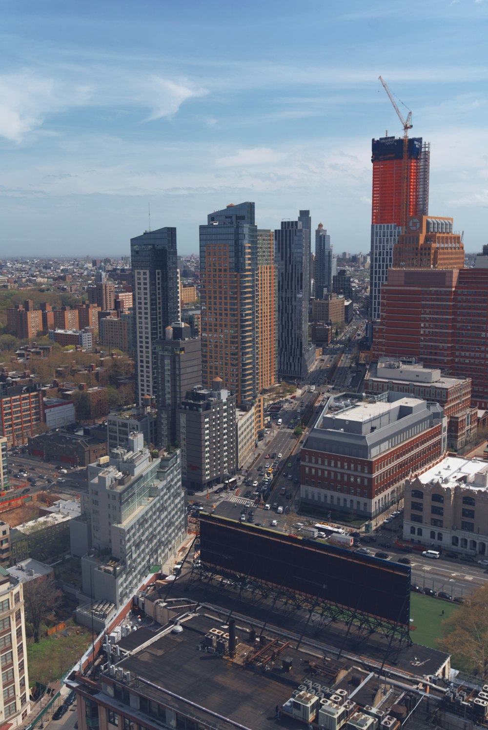 an aerial view of a city with tall buildings