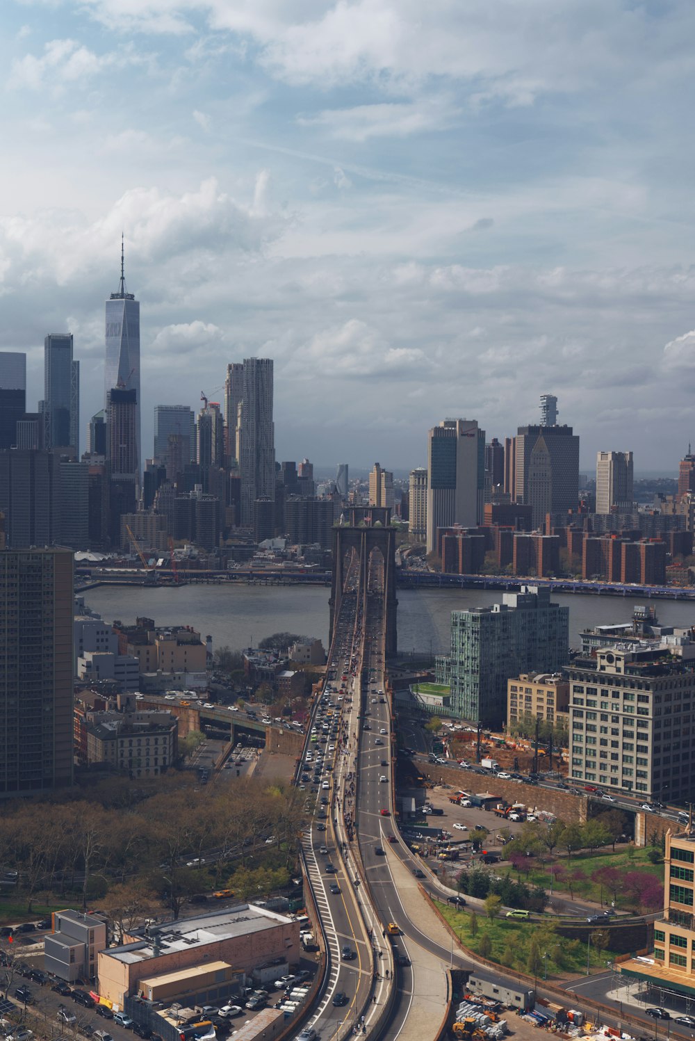 a view of a city with a bridge in the foreground