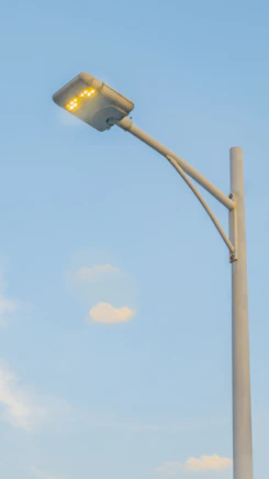 a street light with a blue sky in the background