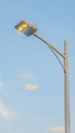 a street light with a blue sky in the background