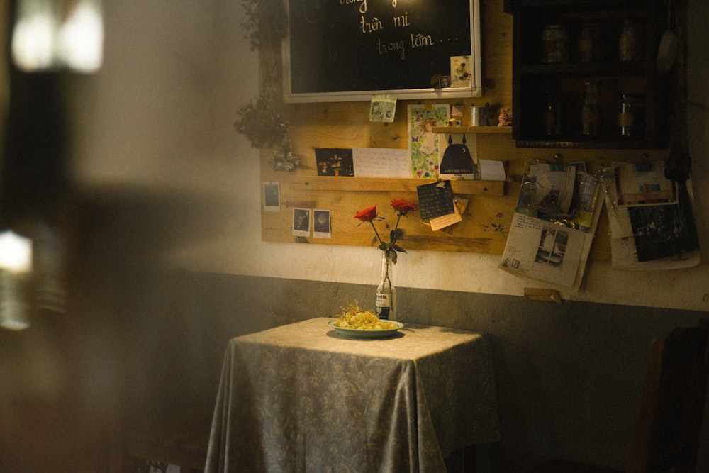 a table with a vase of flowers on it