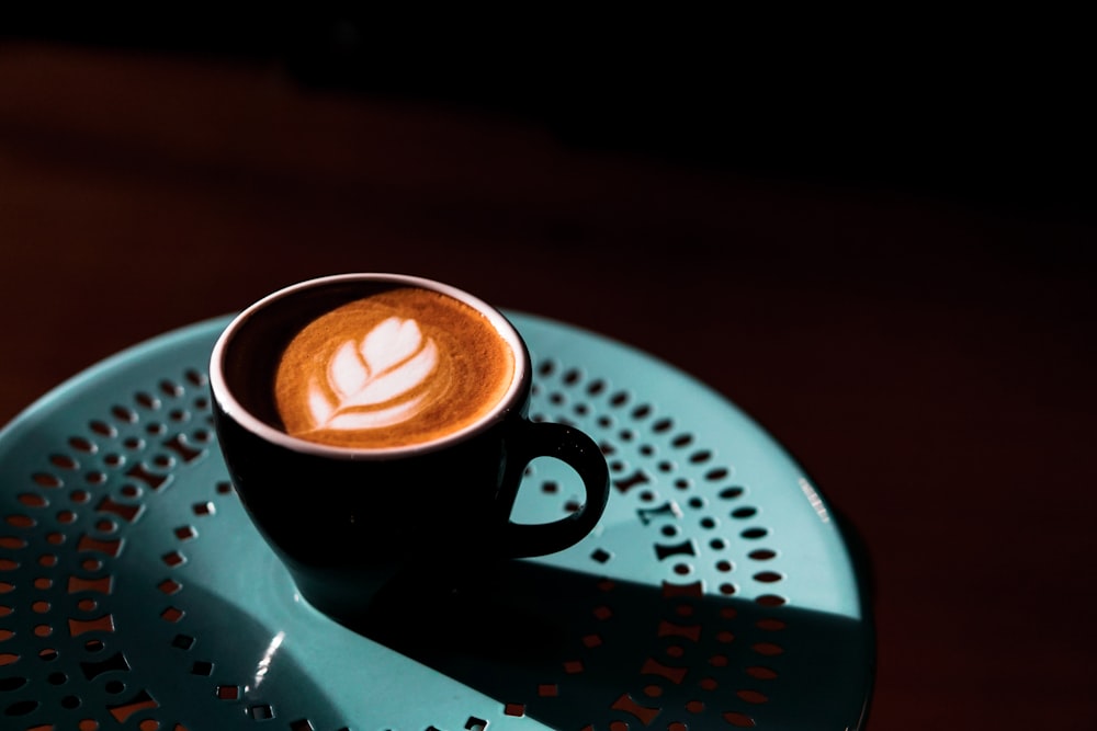 a cup of coffee sitting on top of a saucer