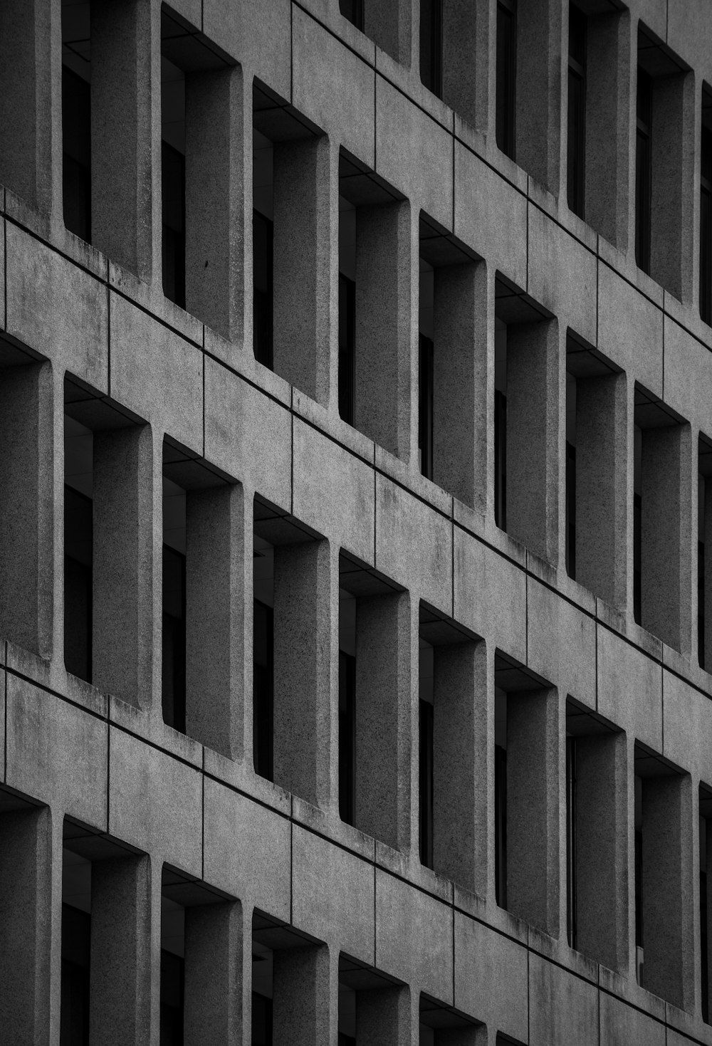 a black and white photo of a building made of concrete blocks