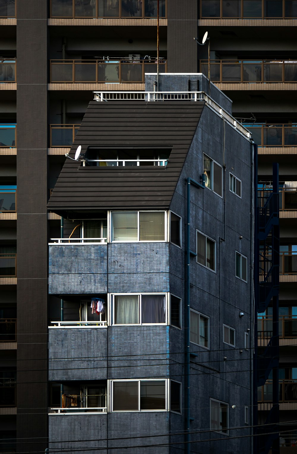 a tall building with balconies and balconies on top of it