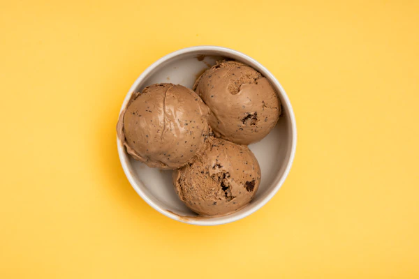 Three scoops on yellow background