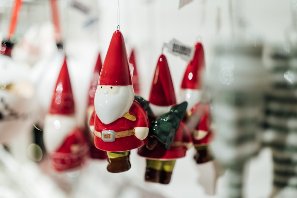 a group of christmas ornaments hanging from strings