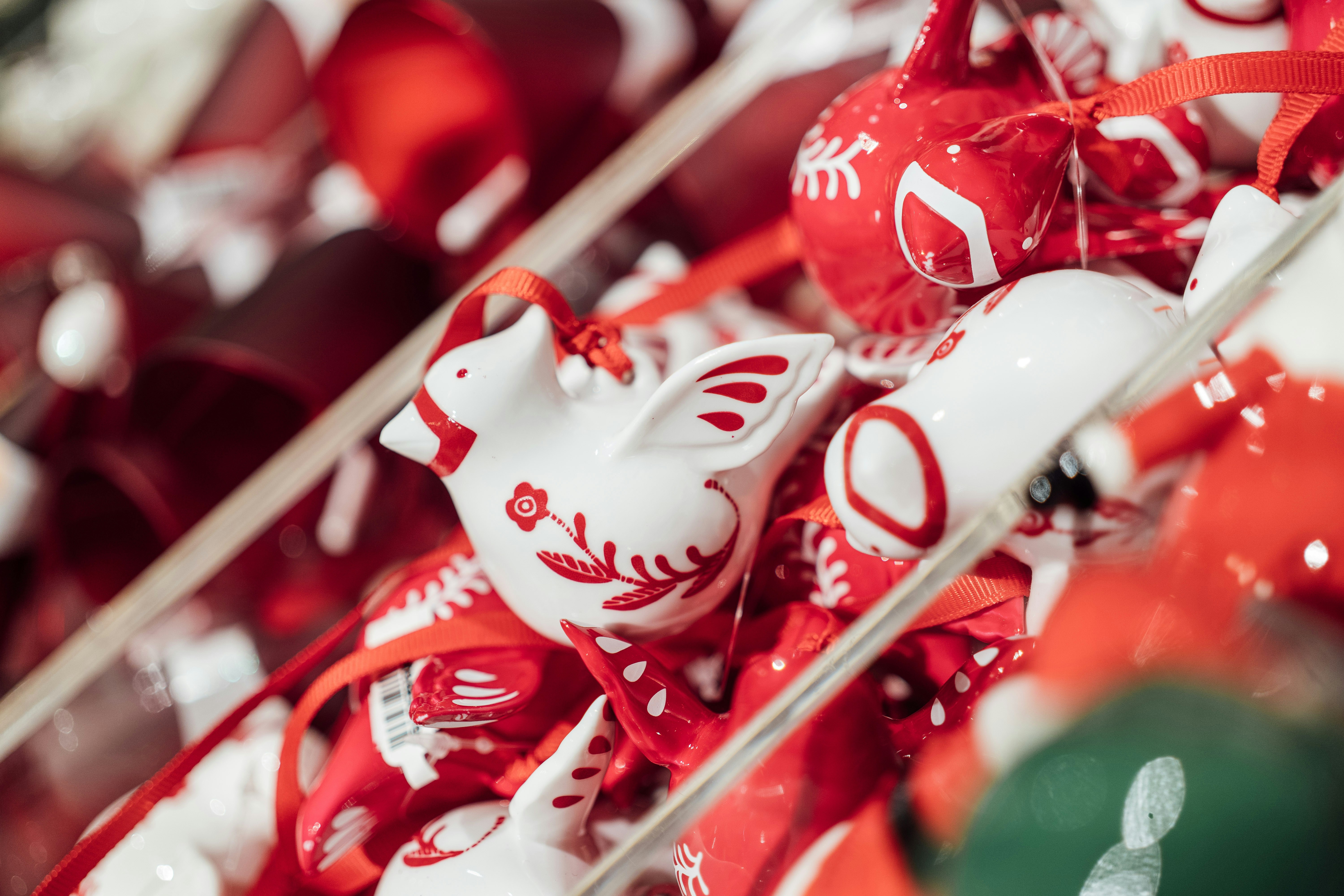 a bunch of red and white christmas ornaments