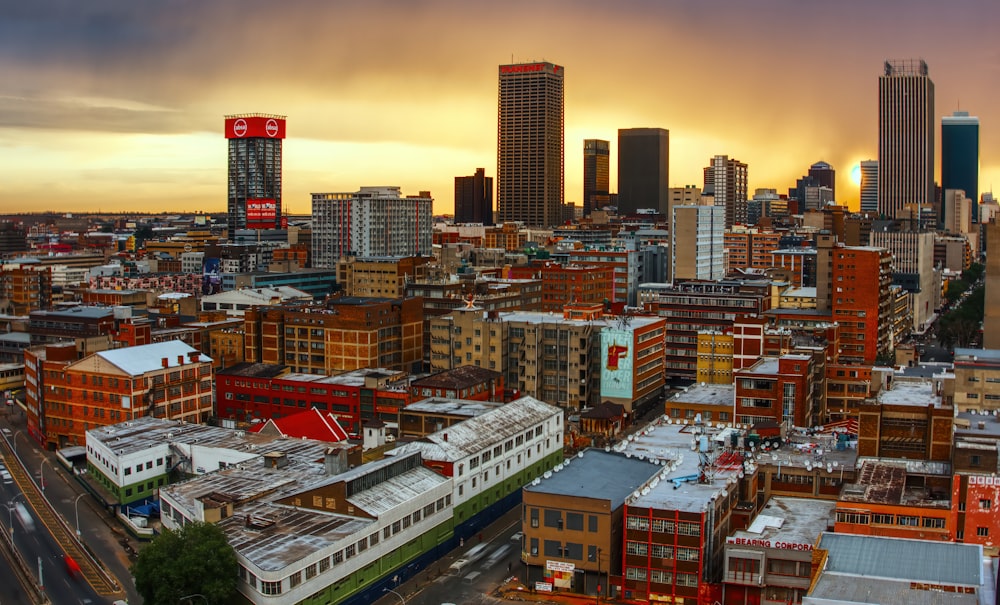 a view of a city with a train in the foreground