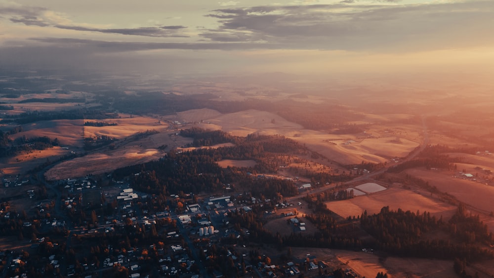 an aerial view of a rural area at sunset