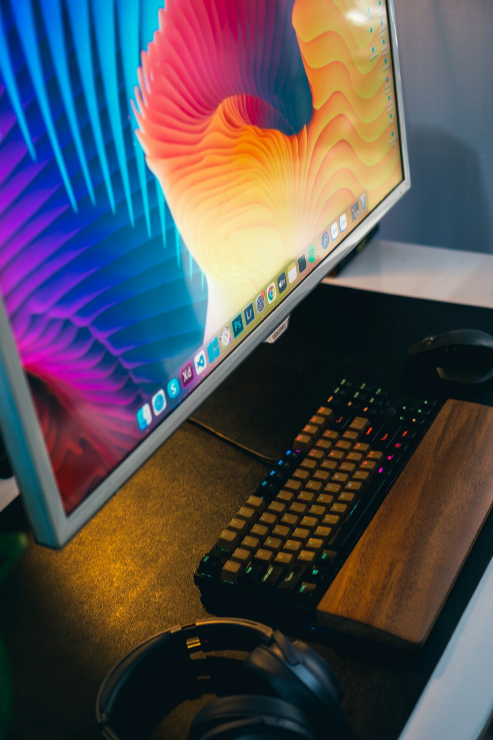 a computer monitor and keyboard on a desk