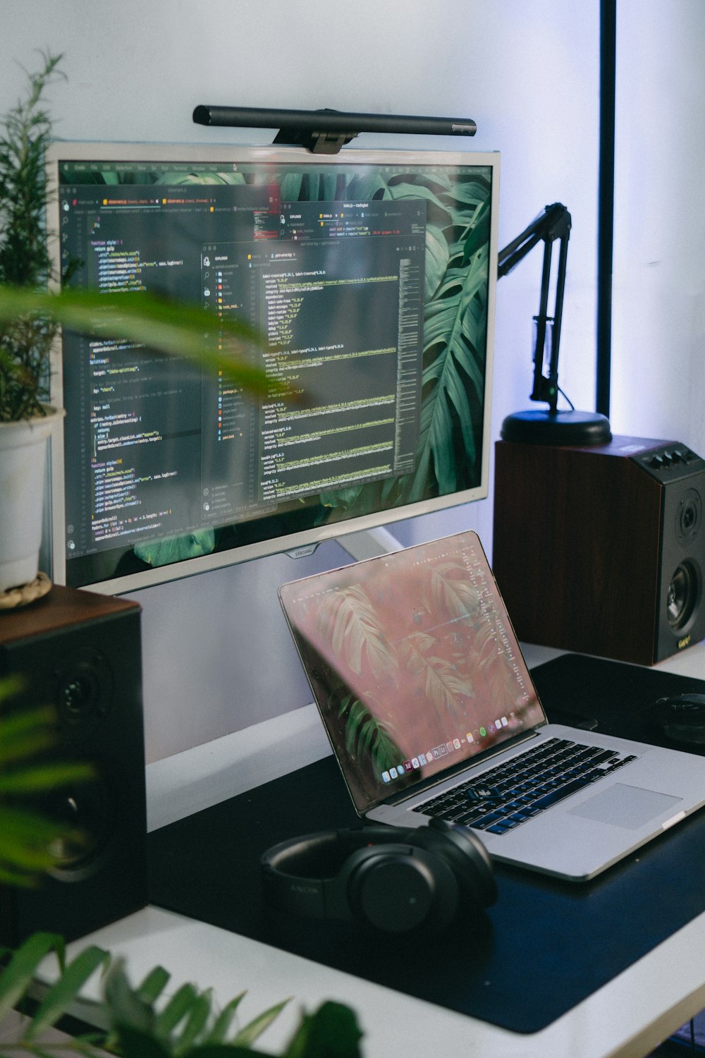 a laptop computer sitting on top of a desk