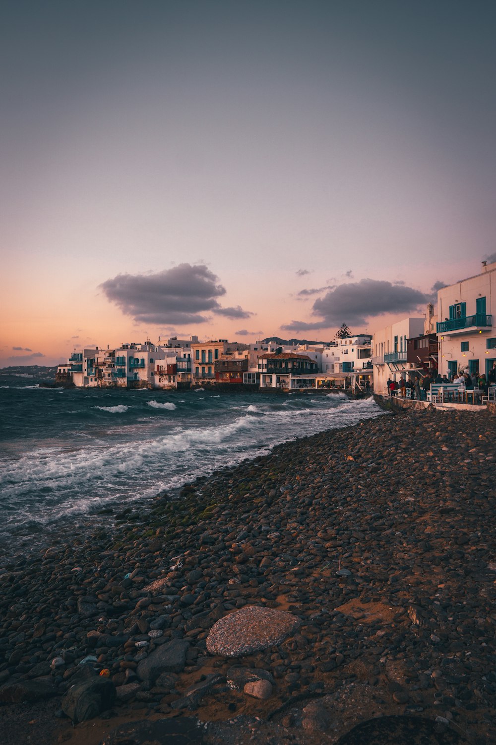 a view of a beach with buildings in the background