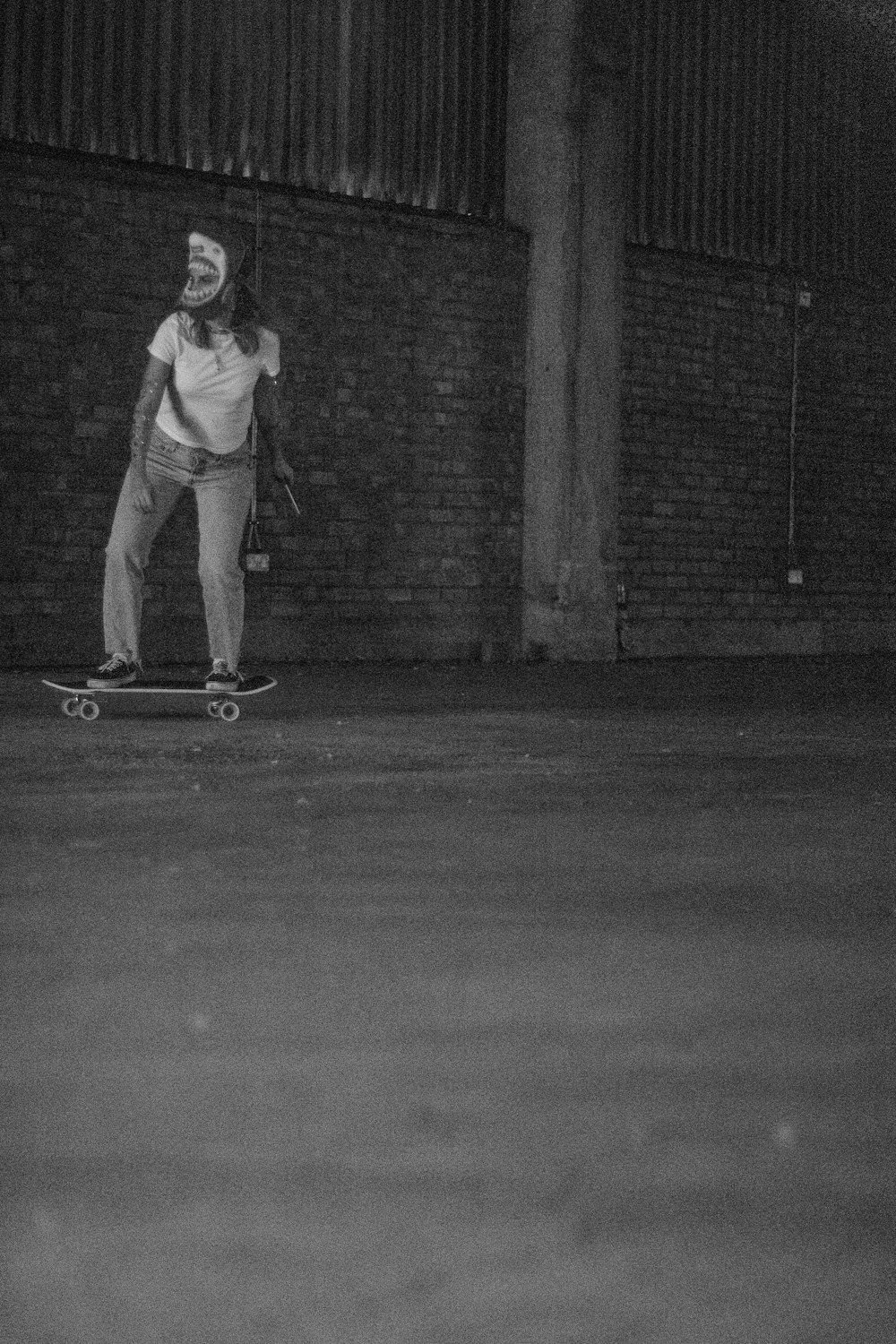 a man riding a skateboard down a street