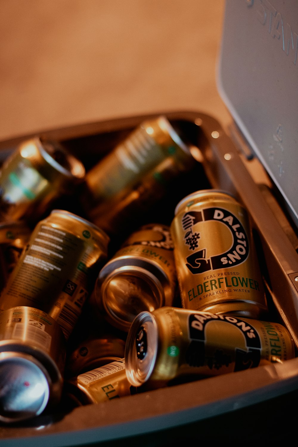 a metal container filled with lots of beer cans