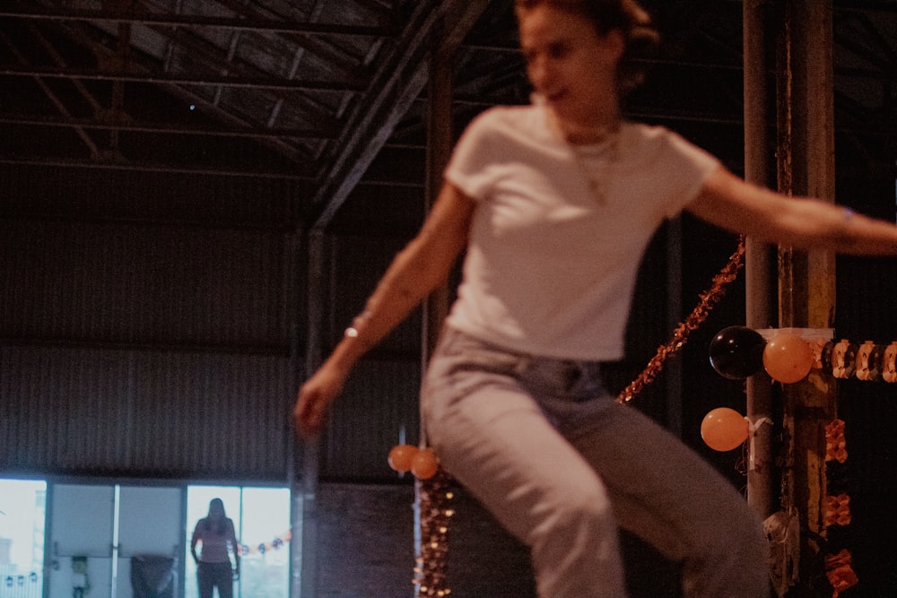 a man riding a skateboard in a warehouse