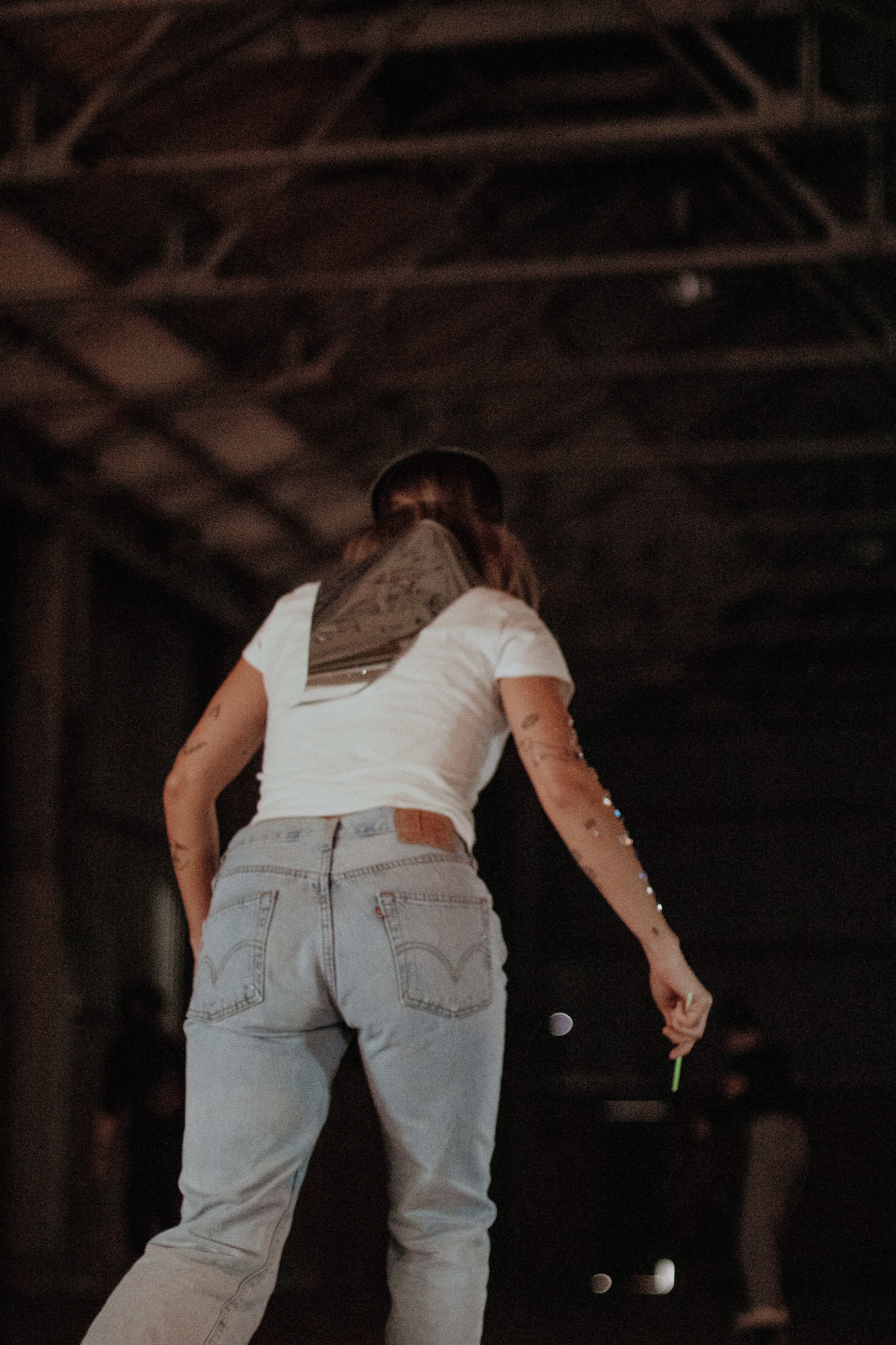 a person riding a skateboard in a warehouse