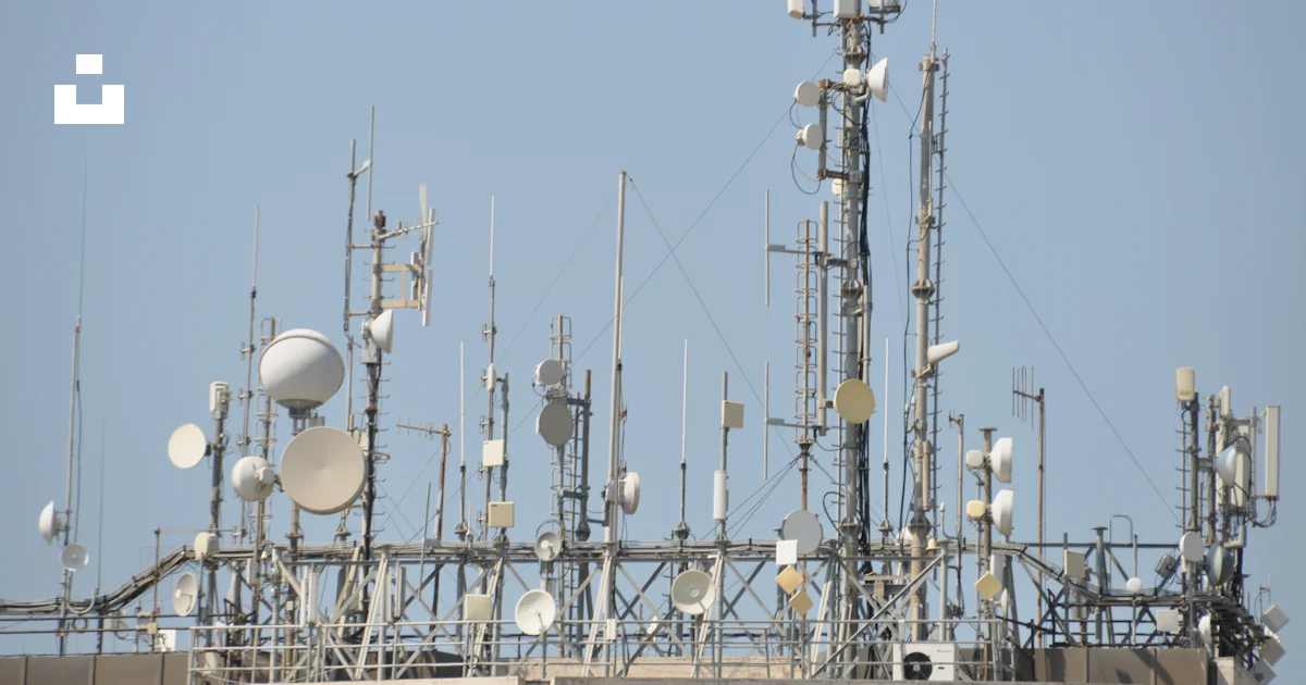 A large array of cell phones on top of a building photo – Free Rome ...