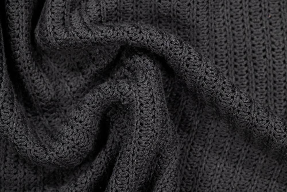 a close up of a gray knitted fabric