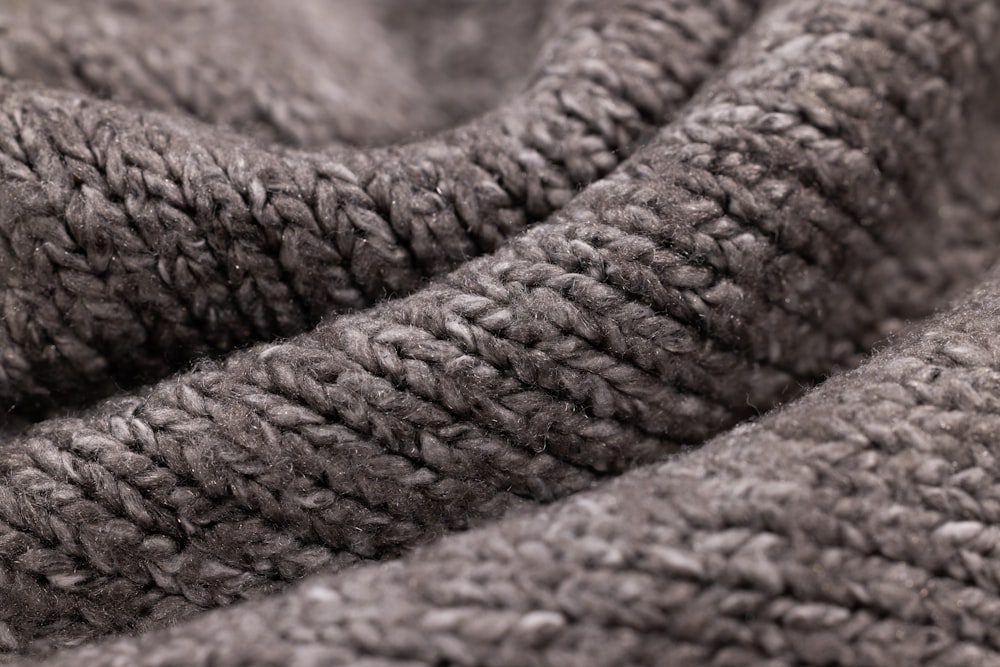 a close up of a blanket with a knot on it