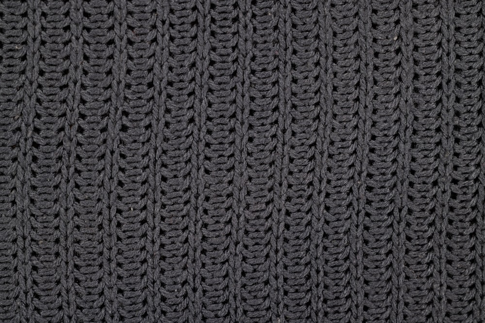 a close up of a black knitted material