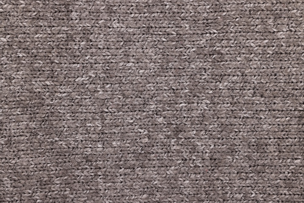 a close up view of a carpet with a gray color