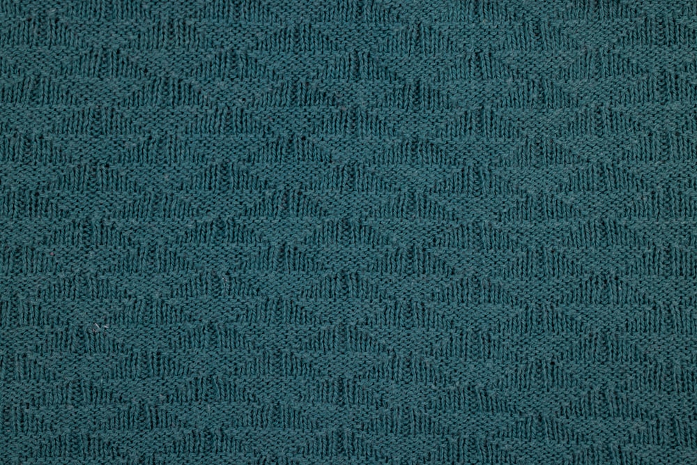 a close up of a blue fabric texture