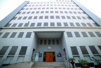 A modern office building of Prime Estates with a welcoming entrance in Dwarka.