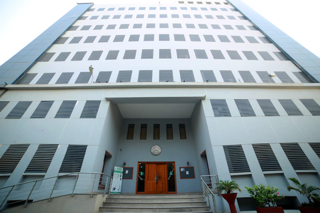 A sleek modern office building with a welcoming entrance, symbolizing trust and professionalism.
