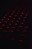a close up of a computer keyboard in the dark