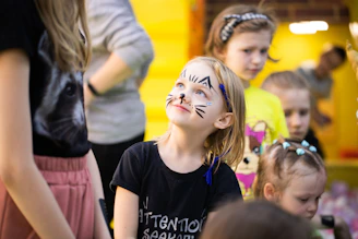 a group of children with face paint on