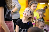 a group of children with face paint on