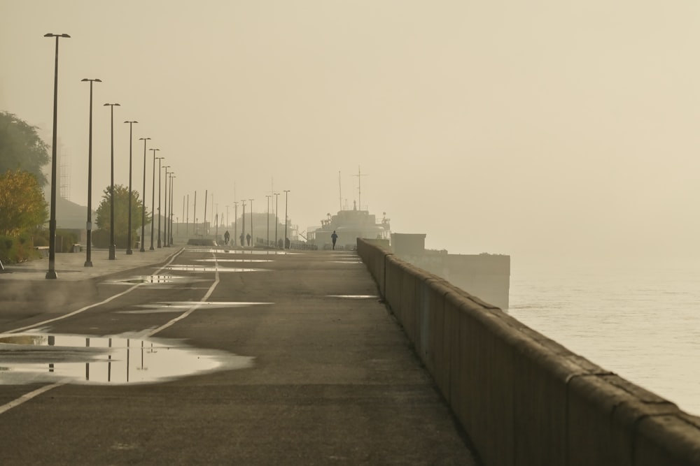 a foggy day along the water's edge