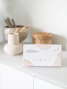 a box of soap sitting on top of a white counter