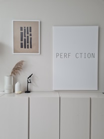 Minimalist home decor accents arranged on a neutral background